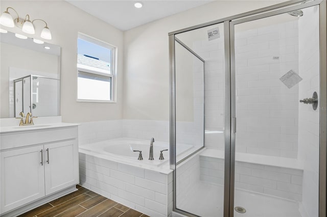 bathroom with vanity and plus walk in shower