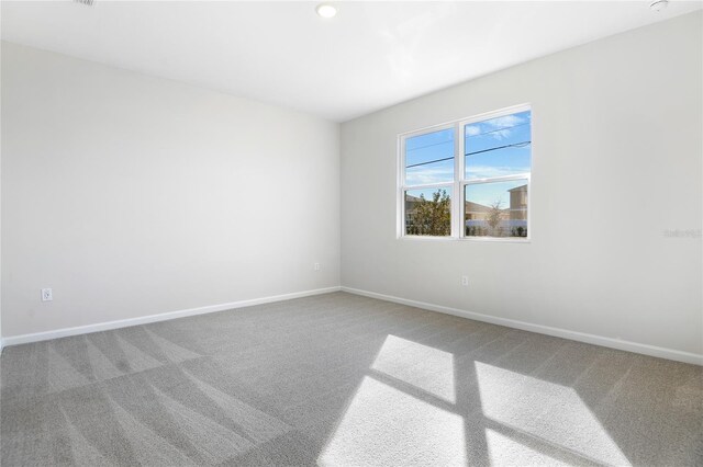 unfurnished room with carpet flooring