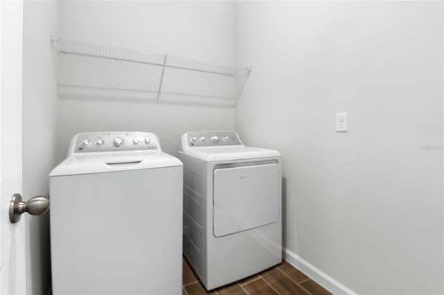 laundry room with separate washer and dryer