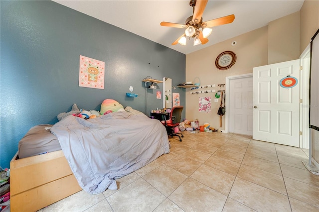 bedroom with light tile patterned flooring and ceiling fan