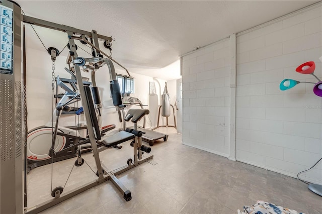 workout area with a textured ceiling