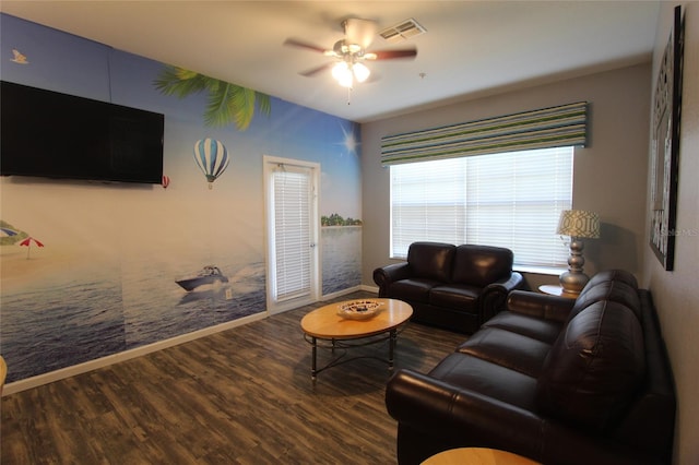 living room with ceiling fan and hardwood / wood-style flooring