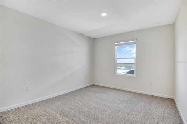 empty room featuring carpet floors