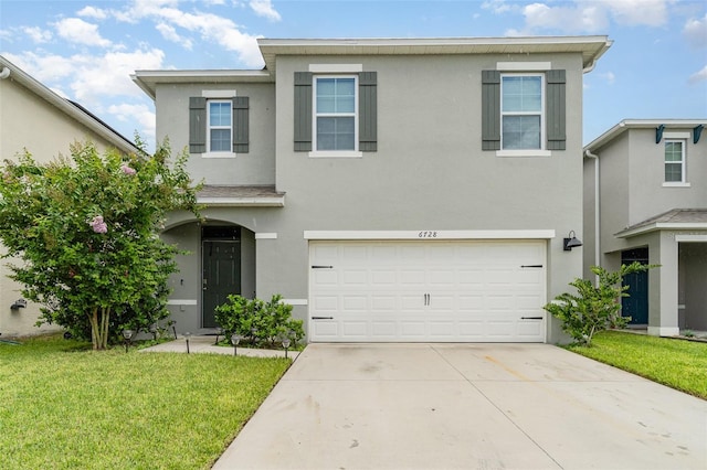6728 Huntleigh Hammock Rd, Harmony, FL 34773 - traditional home featuring stucco siding, an attached garage, driveway, and a front lawn