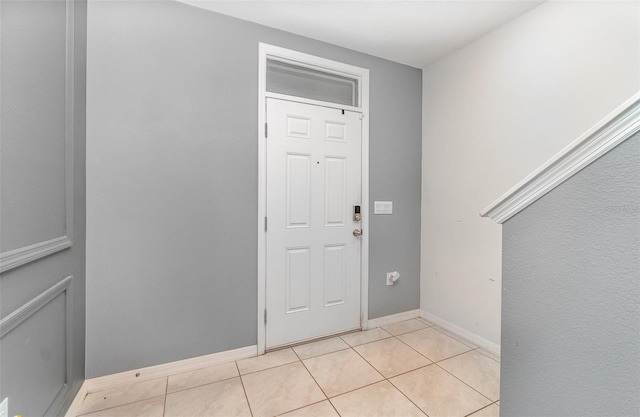 foyer featuring light tile patterned floors