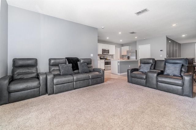 6728 Huntleigh Hammock Rd, Harmony, FL 34773 - living room featuring light colored carpet and recessed lighting