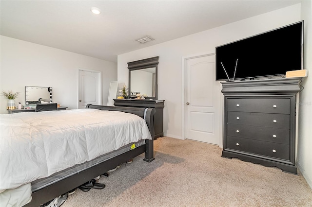 bedroom featuring light carpet