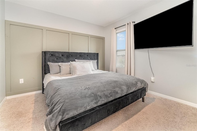 bedroom featuring light carpet