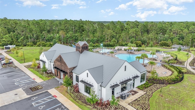 6728 Huntleigh Hammock Rd, Harmony, FL 34773 - drone / aerial view of a heavily wooded area and a pool