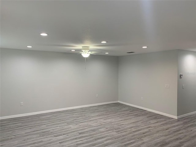 unfurnished room featuring light wood-style floors, recessed lighting, ceiling fan, and baseboards