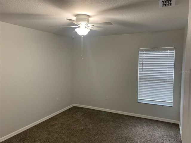 unfurnished room featuring visible vents, carpet flooring, ceiling fan, a textured ceiling, and baseboards