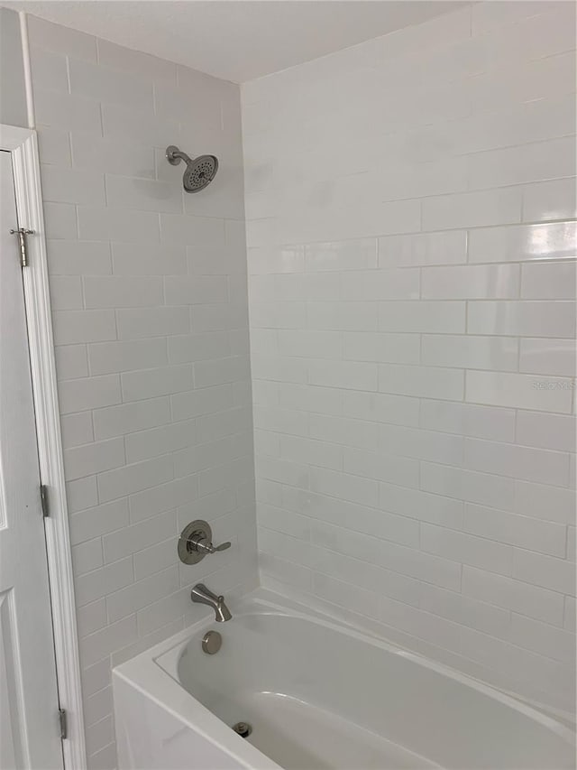 bathroom with shower / tub combination