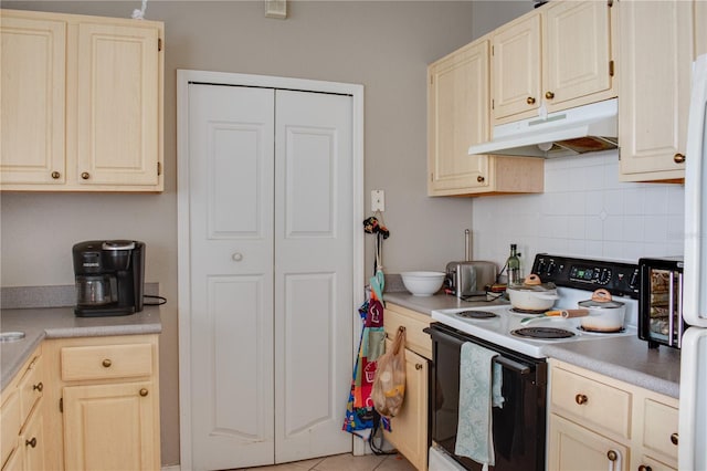 kitchen featuring white electric stove and decorative backsplash