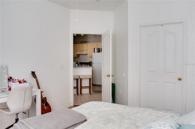 1100 Lake Shadow Cir Unit 2101, Maitland, FL 32751 - bedroom featuring freestanding refrigerator, light tile patterned flooring, and baseboards