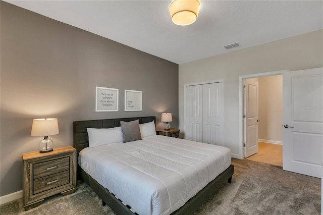 bedroom with carpet and a closet