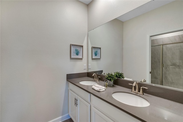 bathroom with vanity and walk in shower