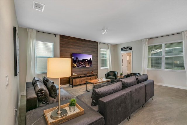 living room featuring wood walls