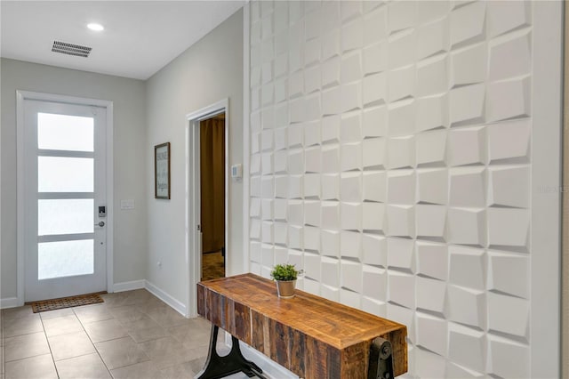 foyer featuring light tile patterned floors