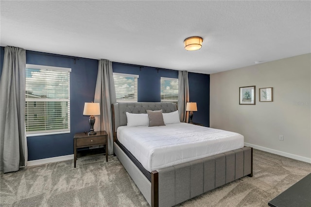 carpeted bedroom with a textured ceiling