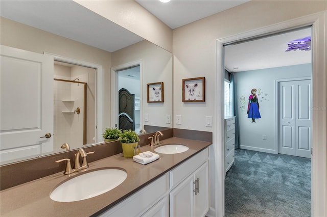 bathroom featuring vanity and an enclosed shower