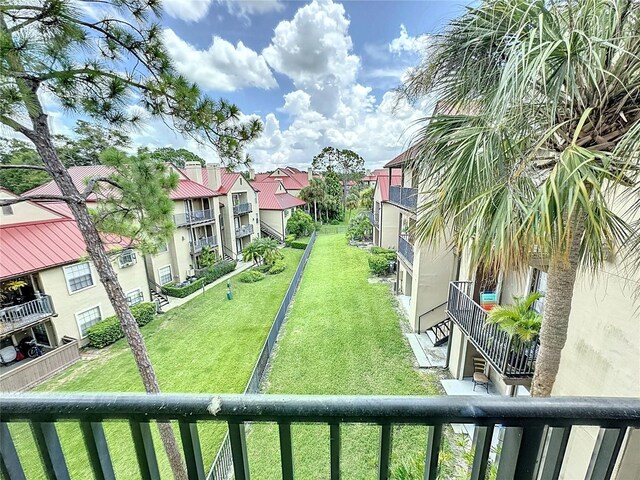 view of yard featuring a balcony