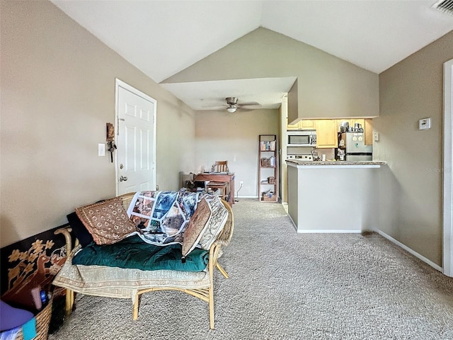 living room with vaulted ceiling, carpet, and ceiling fan