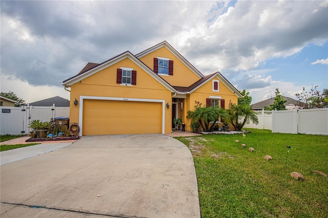 view of front facade with a garage and a front yard