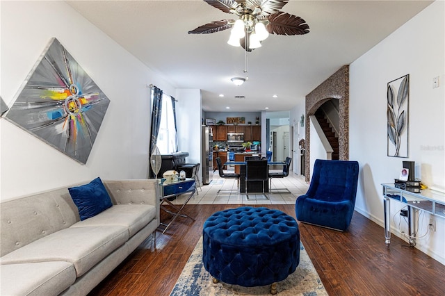 living room with ceiling fan and hardwood / wood-style floors