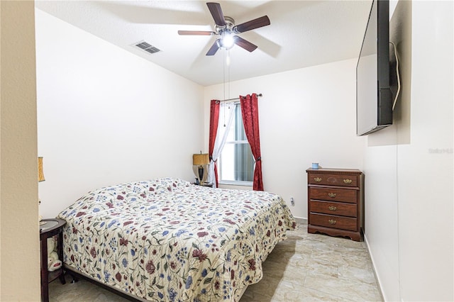 bedroom featuring light tile patterned flooring and ceiling fan