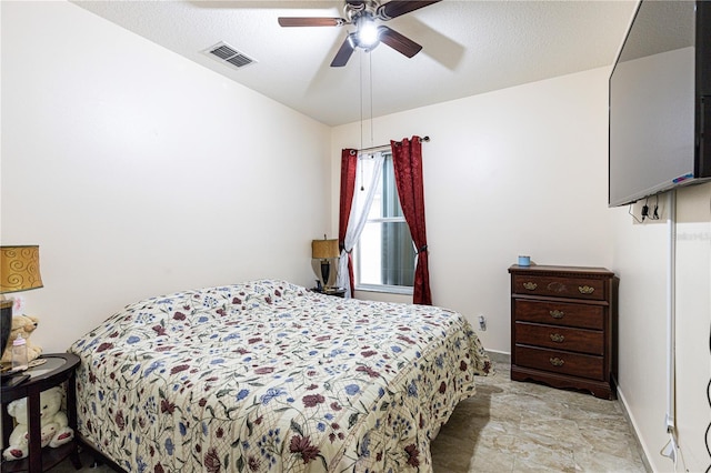 bedroom featuring a textured ceiling, light tile patterned floors, lofted ceiling, and ceiling fan