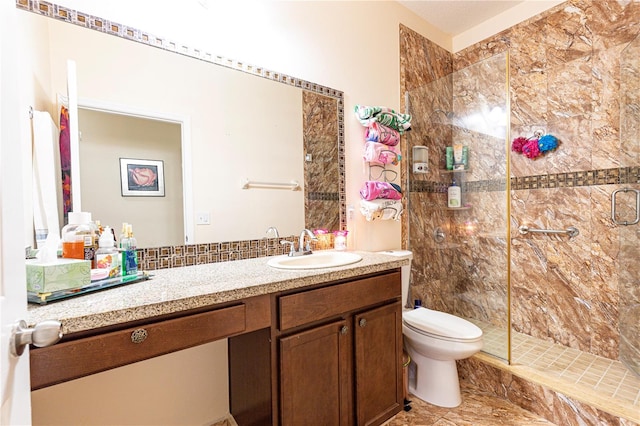 bathroom with vanity, a shower with door, tile patterned flooring, and toilet