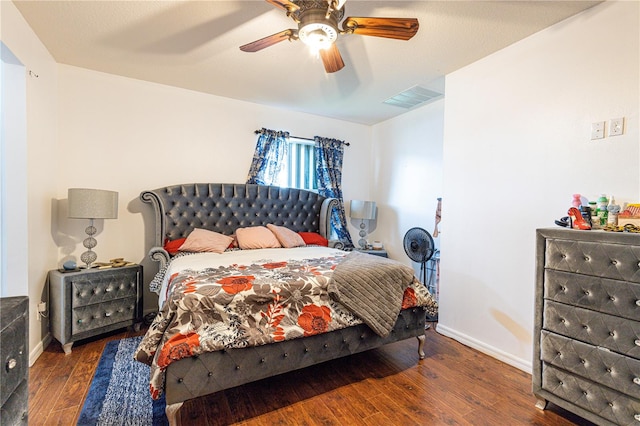 bedroom featuring dark hardwood / wood-style floors and ceiling fan