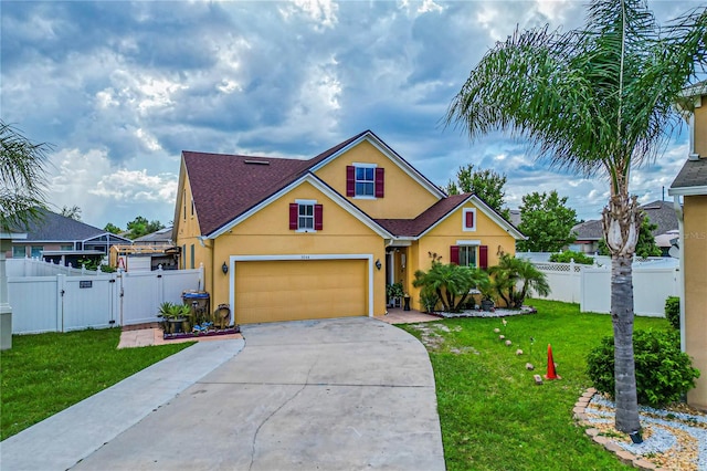 view of front facade with a garage and a front lawn