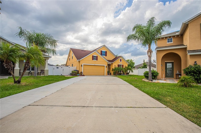 view of front facade with a garage and a front yard