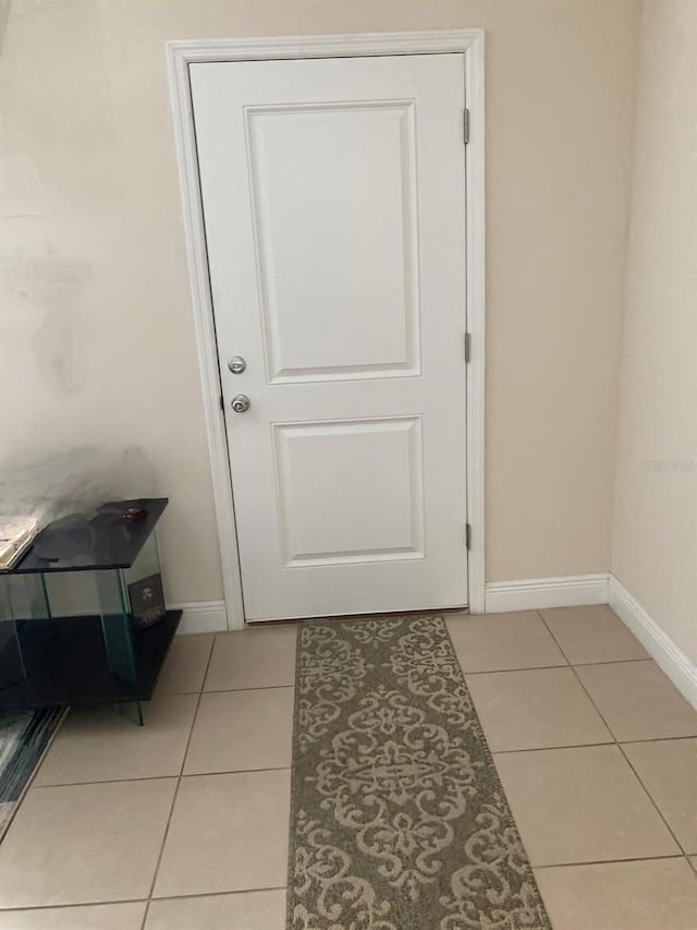 doorway featuring light tile patterned floors