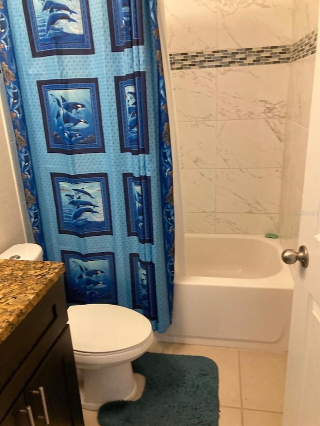 full bathroom with vanity, toilet, shower / tub combo with curtain, and tile patterned flooring