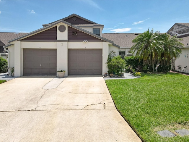 view of front facade featuring a garage and a front lawn