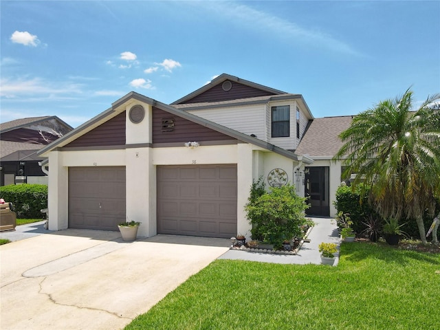 view of front of house featuring a garage and a front lawn