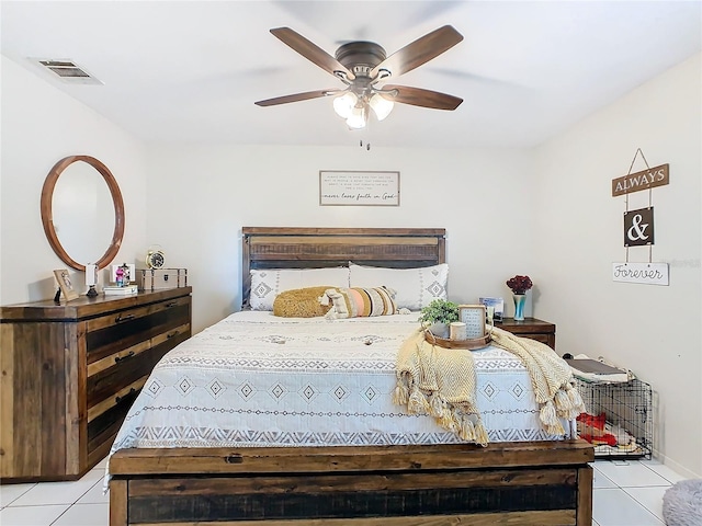 tiled bedroom with ceiling fan