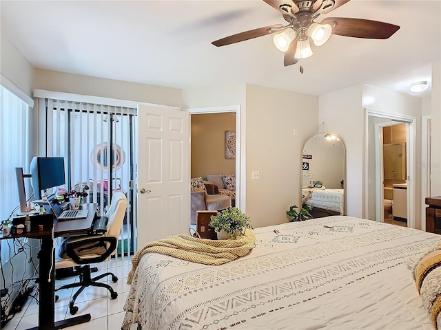 bedroom featuring ceiling fan, connected bathroom, and light tile patterned floors