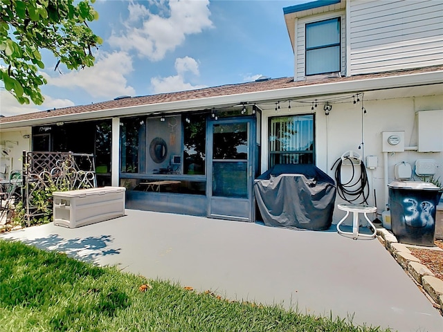 back of property featuring a patio