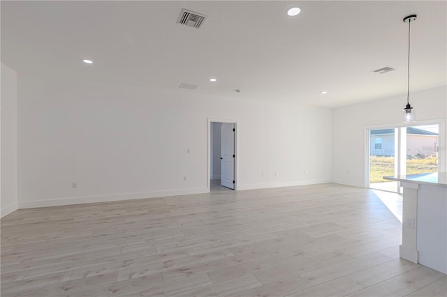 unfurnished room featuring light hardwood / wood-style flooring