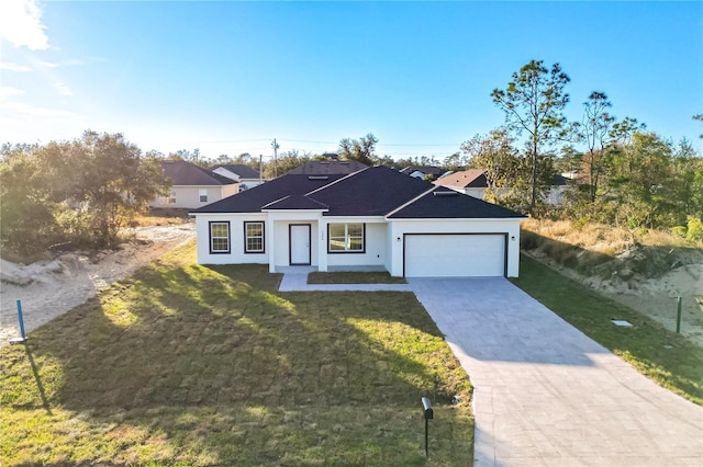 single story home featuring a garage and a front lawn