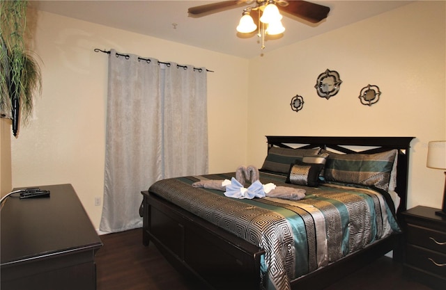 bedroom featuring dark hardwood / wood-style flooring and ceiling fan