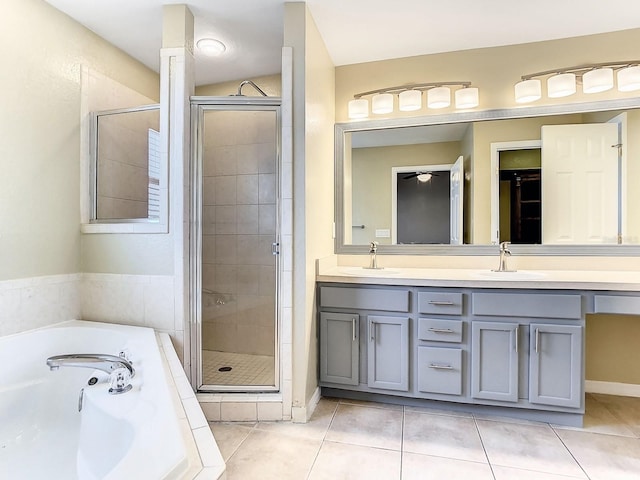 bathroom with vanity, tile patterned floors, and shower with separate bathtub