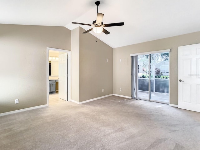 unfurnished room featuring ceiling fan, lofted ceiling, and light carpet