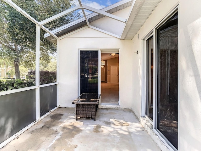 unfurnished sunroom featuring vaulted ceiling