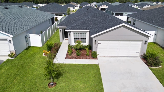 view of front of house with a garage and a front yard