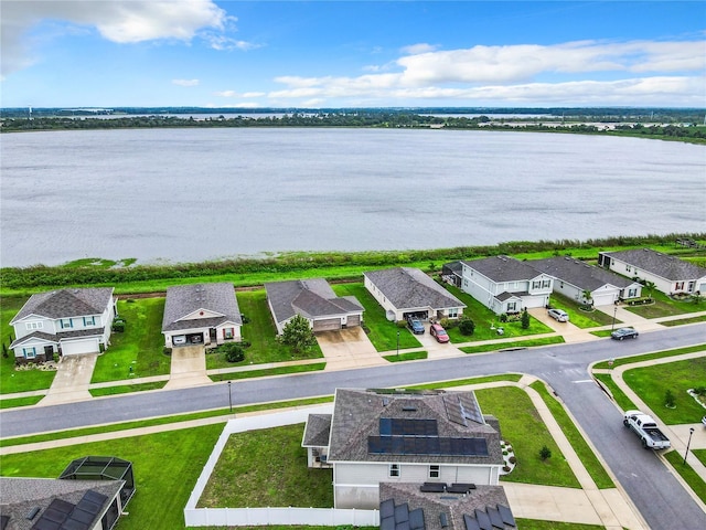 aerial view featuring a residential view and a water view