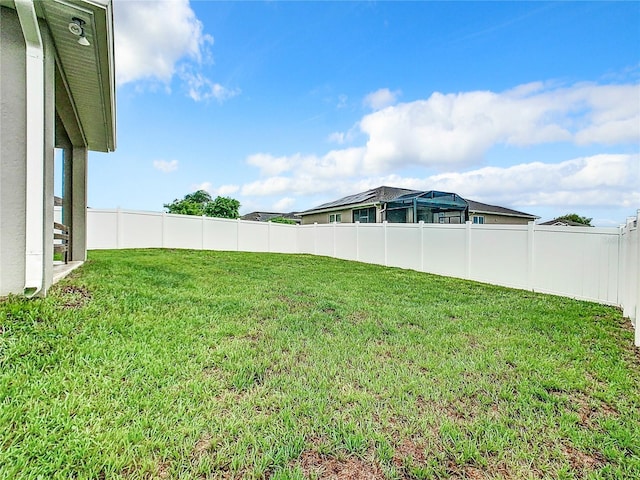 view of yard with fence